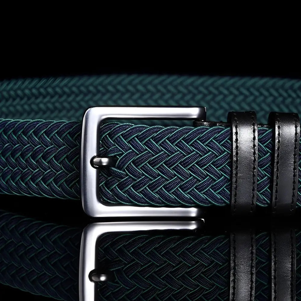Green braided elastic belt with silver buckle and leather accents for stylish wear