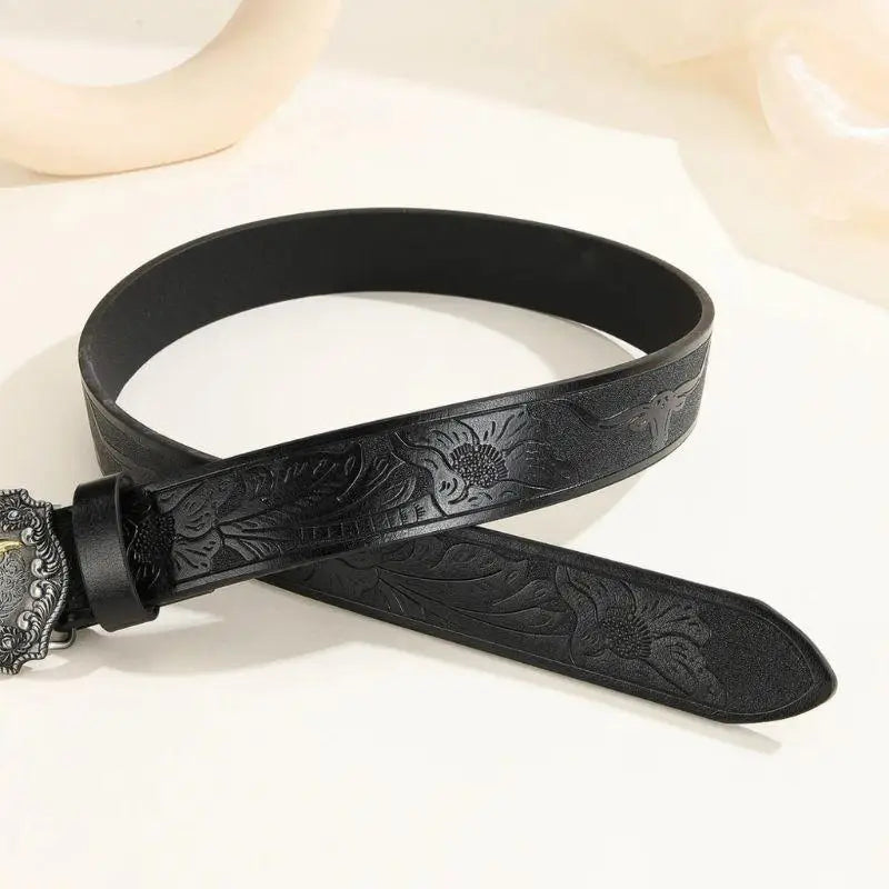 Black floral embossed leather belt with ornate Bull Buckle for stylish accessories