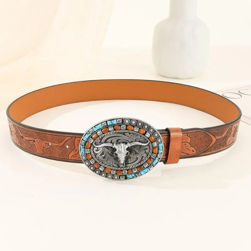 Brown leather belt featuring a steer skull buckle for Western style fashion