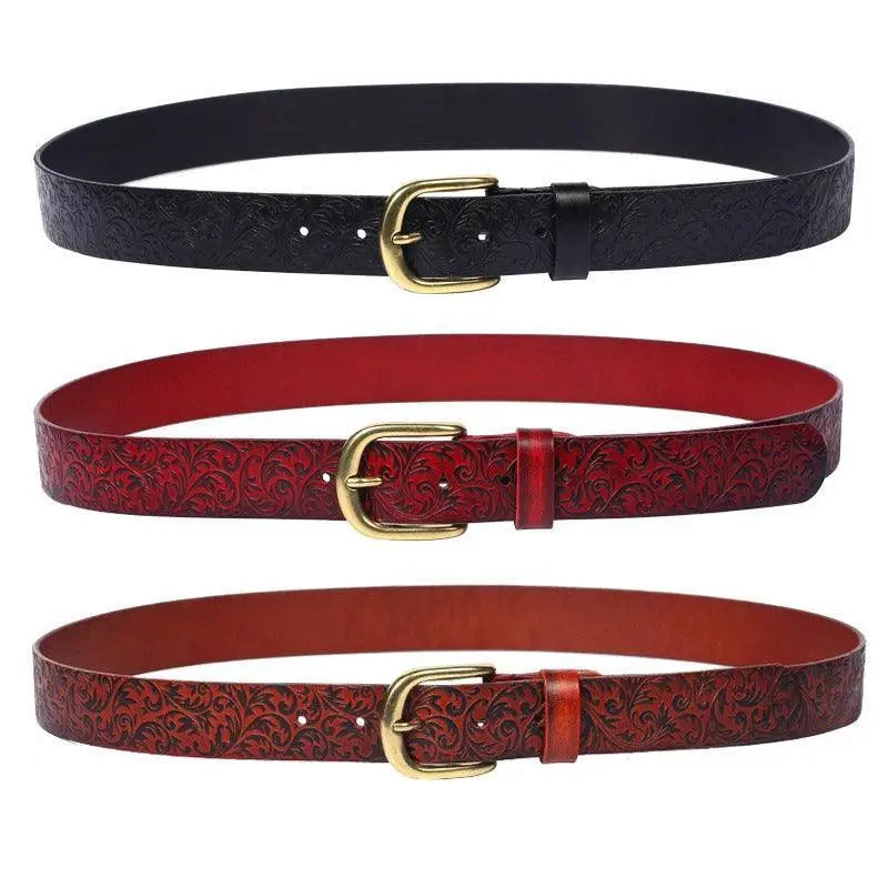 Three patterned Eyota Western Leather Belts with gold buckles on display