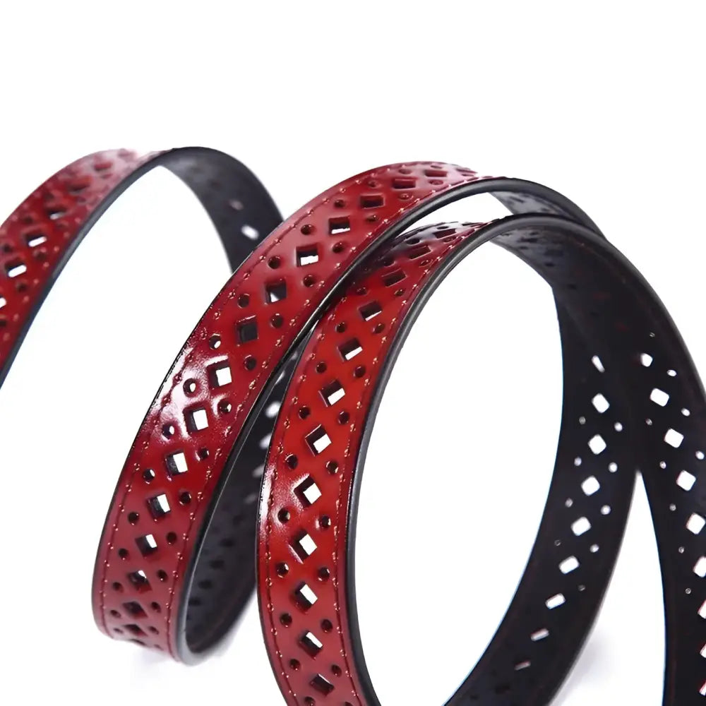 Burgundy leather belt with geometric cutouts for distressed denim shorts style