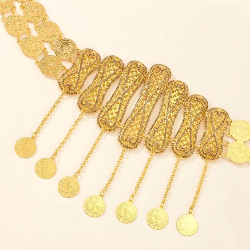 Gold-colored coin and intricate filigree belt belly chain jewelry piece