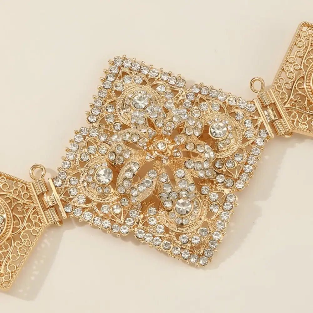 Ornate gold-tone Moroccan belt with rhinestone embellishments and intricate design