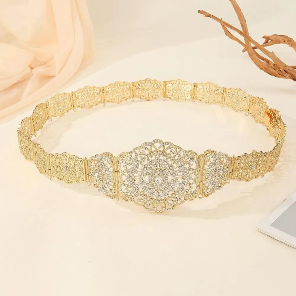 Gold-tone metal Moroccan belt with rhinestone embellishments and ornate detailing for luxury fashion