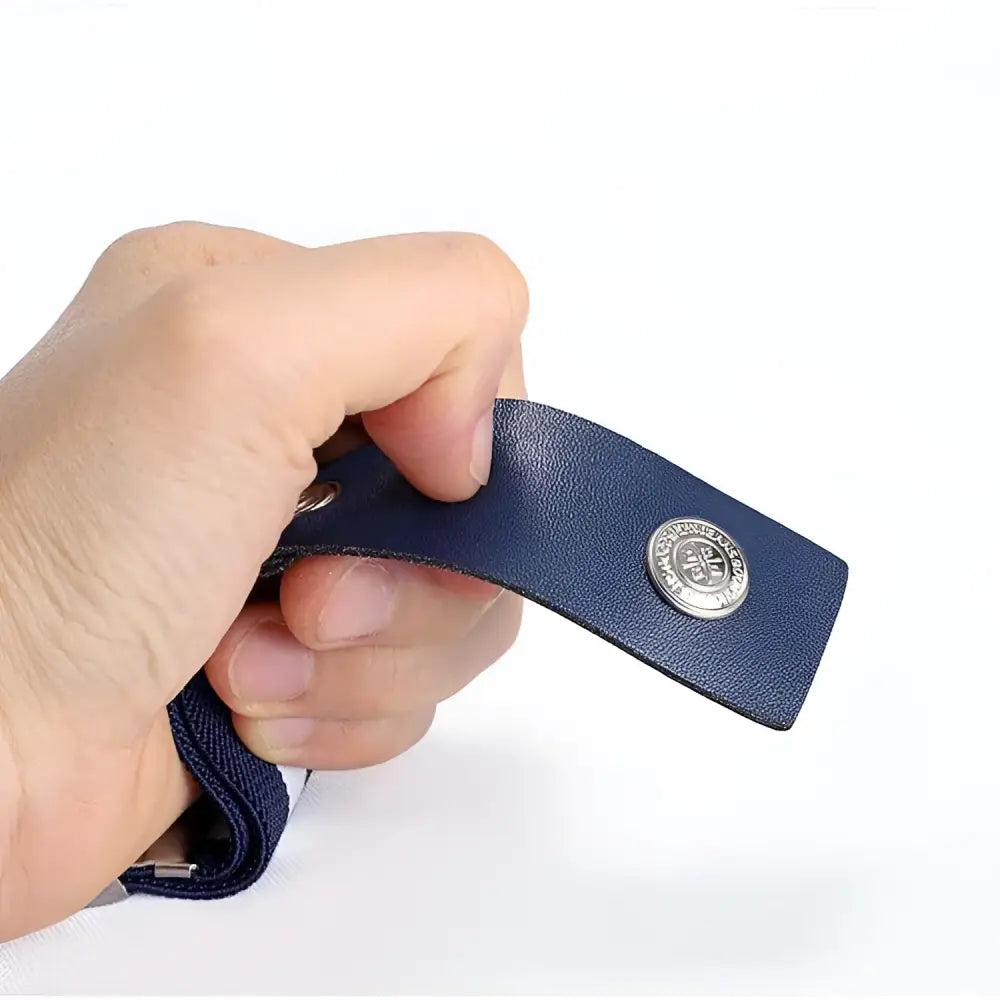 Blue leather strap with button from the Araldo Belt featured on Jeans with yellow fasteners