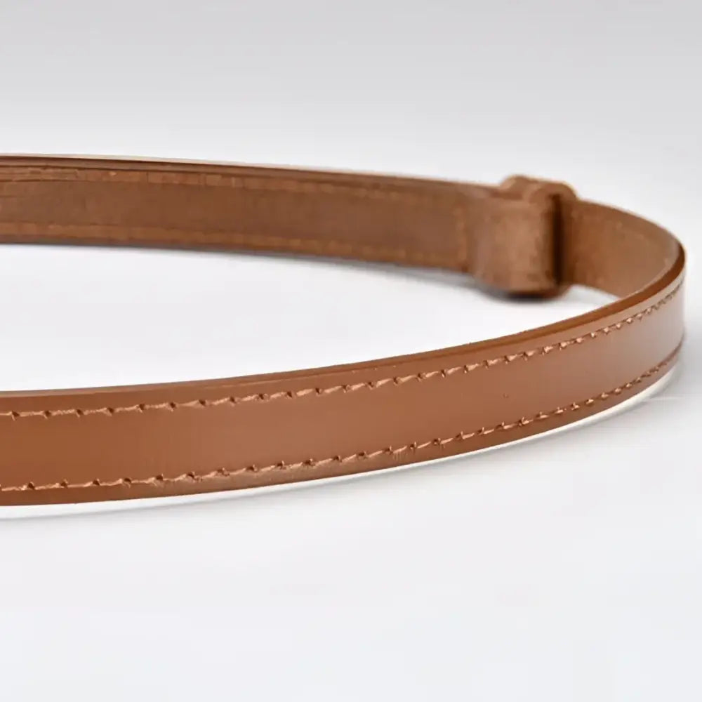 Brown stitched leather belt with gold buckle to enhance personal style and sophistication