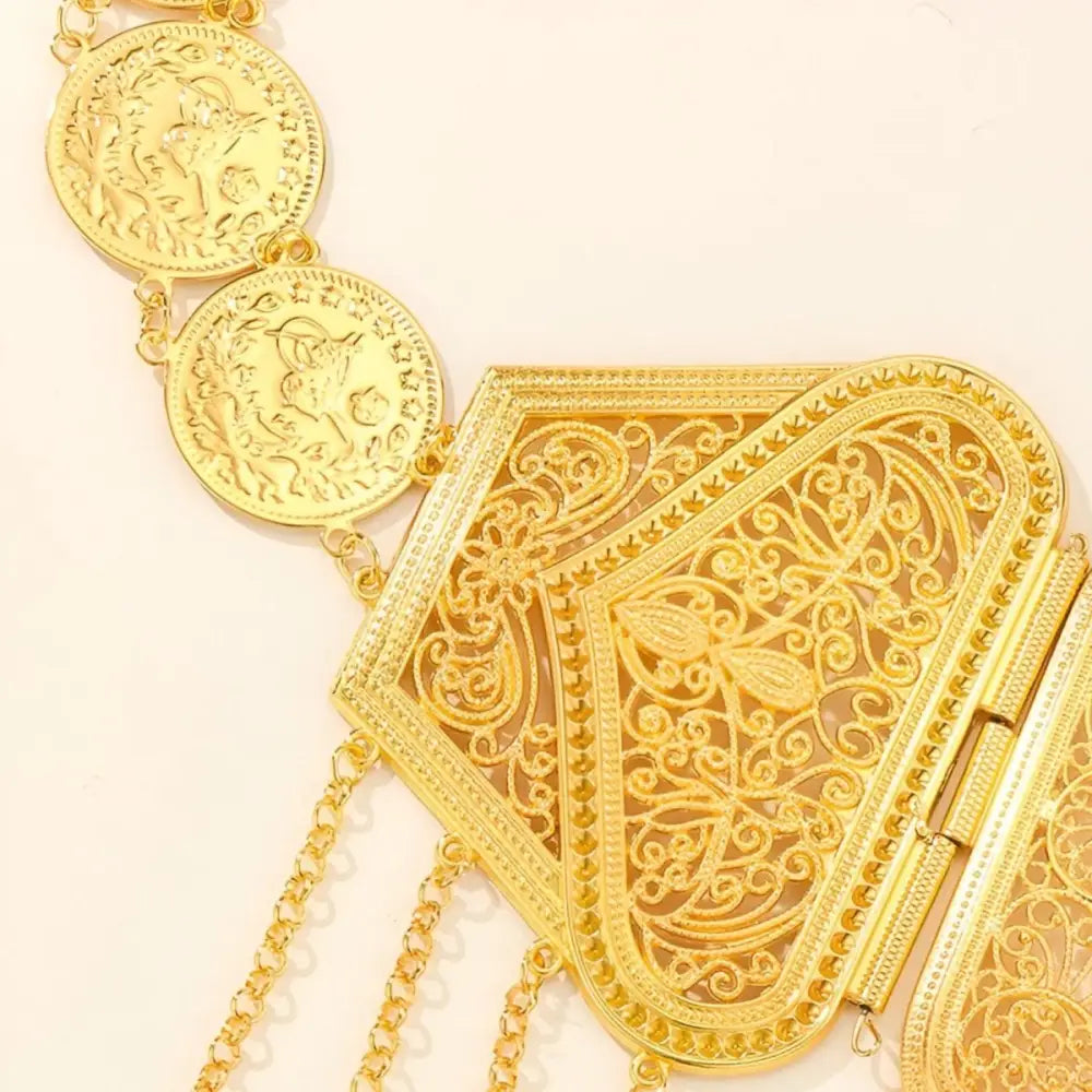 Ornate gold coin belt with dangles showcasing intricate craftsmanship and luxurious design
