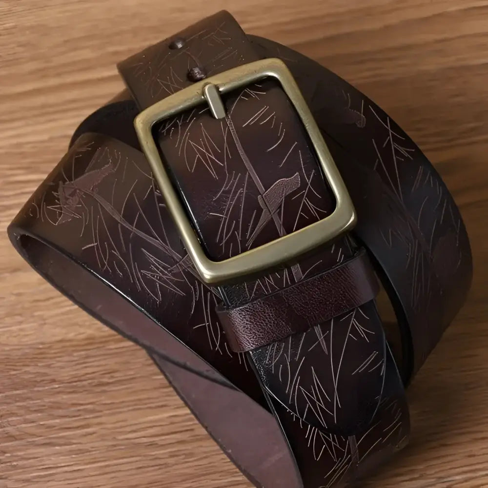 Set of four brown leather belts with brass buckles displayed for stylish men’s accessories
