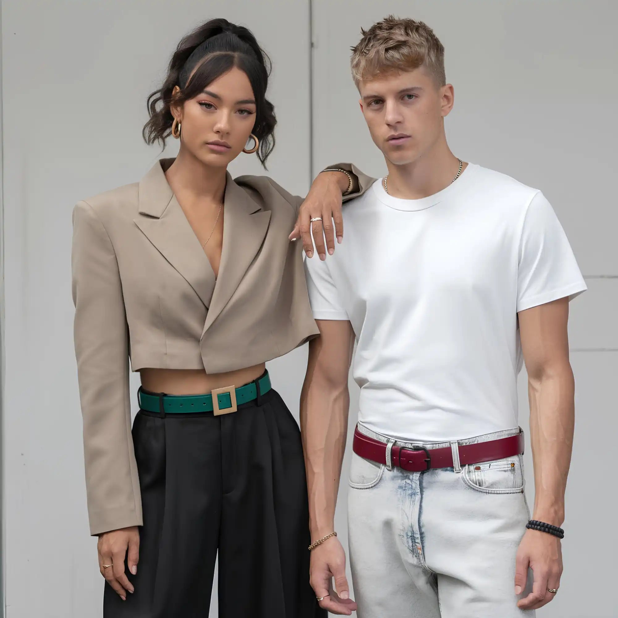 Two models wearing belts.