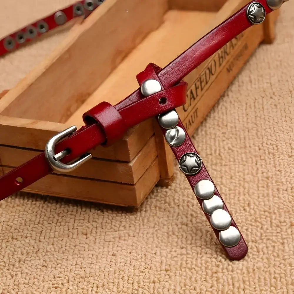 Red studded women’s leather belt from Alpui Women’s Leather Belt Collection