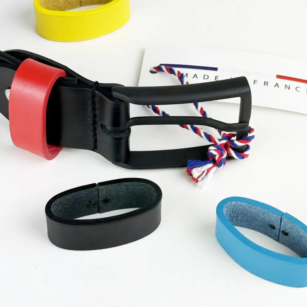 Black leather belt with colorful loops, red accent, and metal buckle for stylish wear
