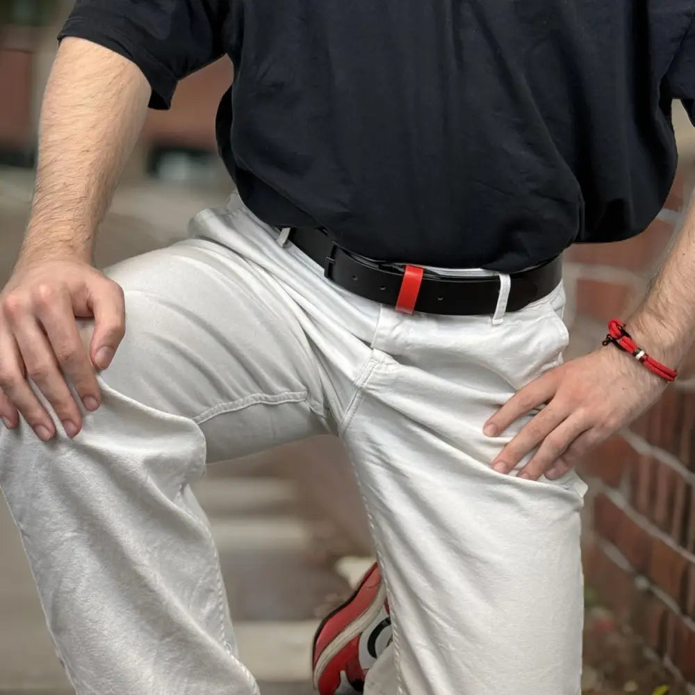Black leather belt with red accent and metal buckle for stylish accessories