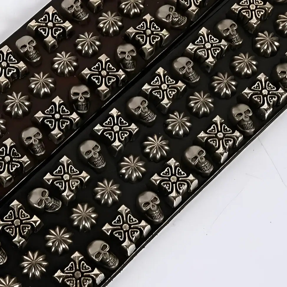 Black leather belt with silver skull and cross stud embellishments for a bold style