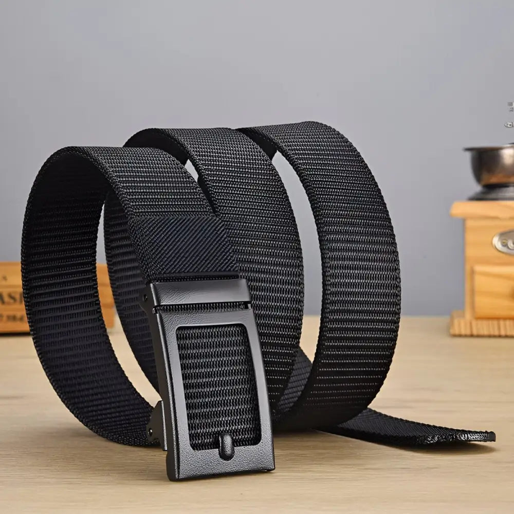 Black nylon web belt with a metal buckle suitable for casual and formal wear
