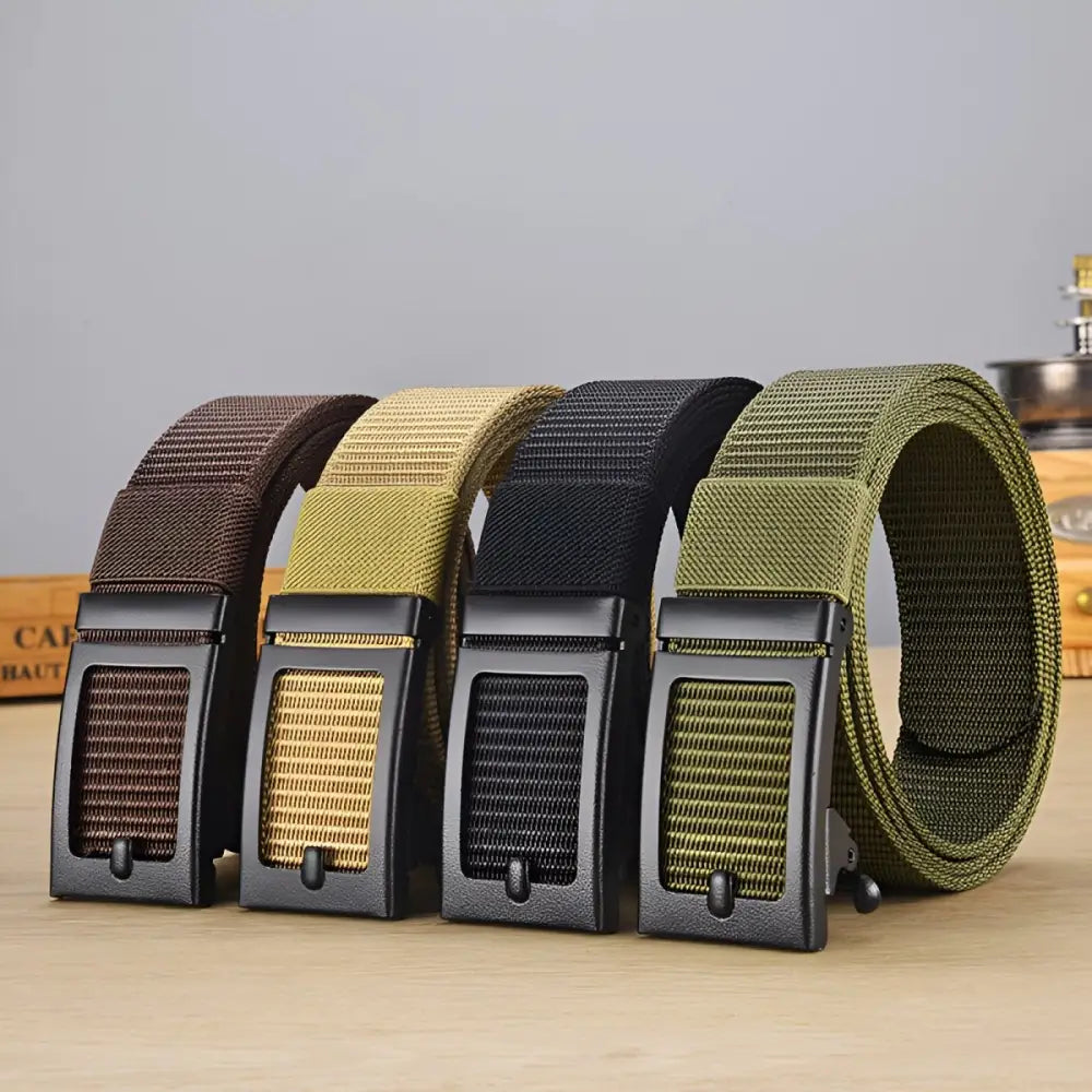Four black nylon web belts with metal buckles displayed in a product showcase