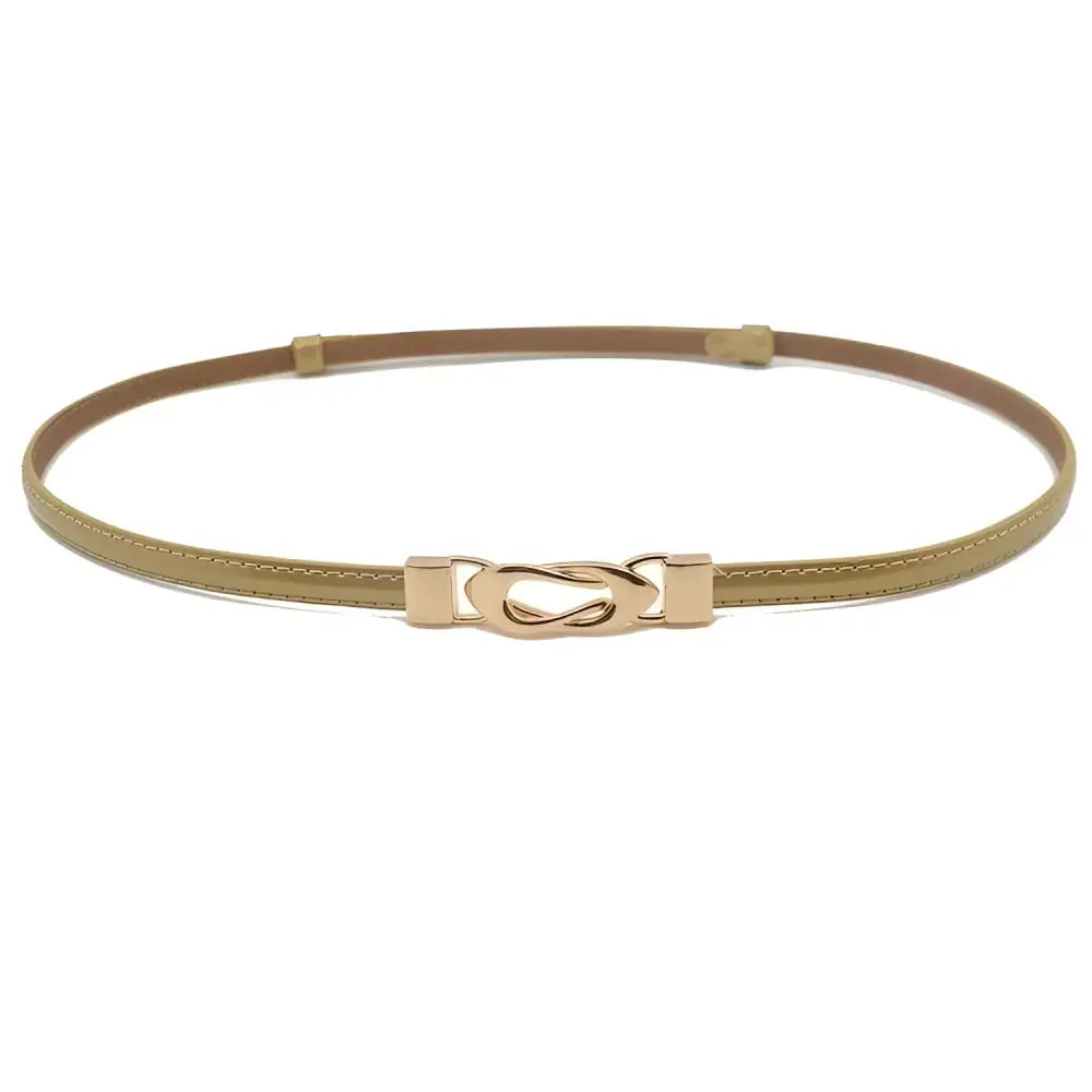 Black patent leather belt with a thin gold decorative buckle for elegant fashion accessorie