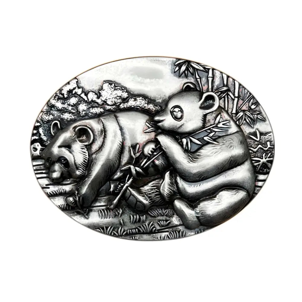 Silver panda coin displayed on a Golden and Silver Panda Relief Belt Buckle with Panda designs