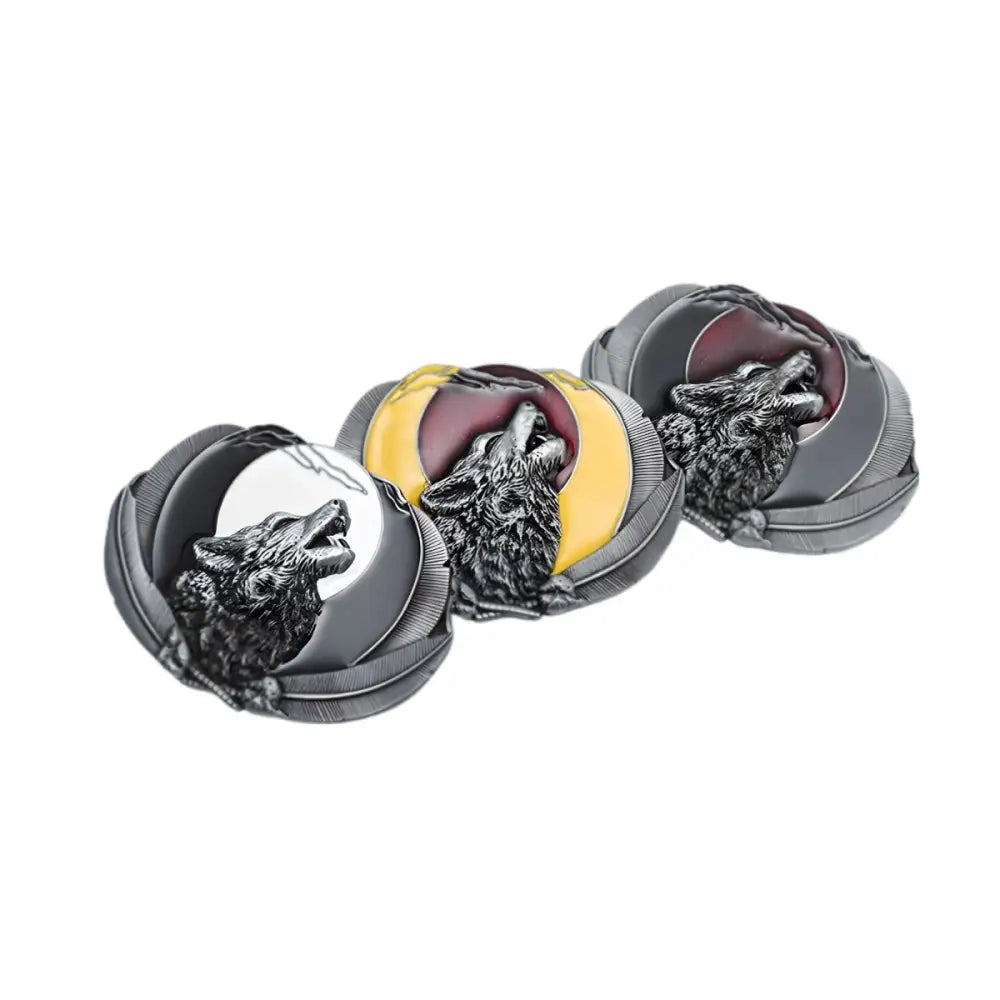 Three wolf-themed belt buckles featuring wolves howling at the moon design