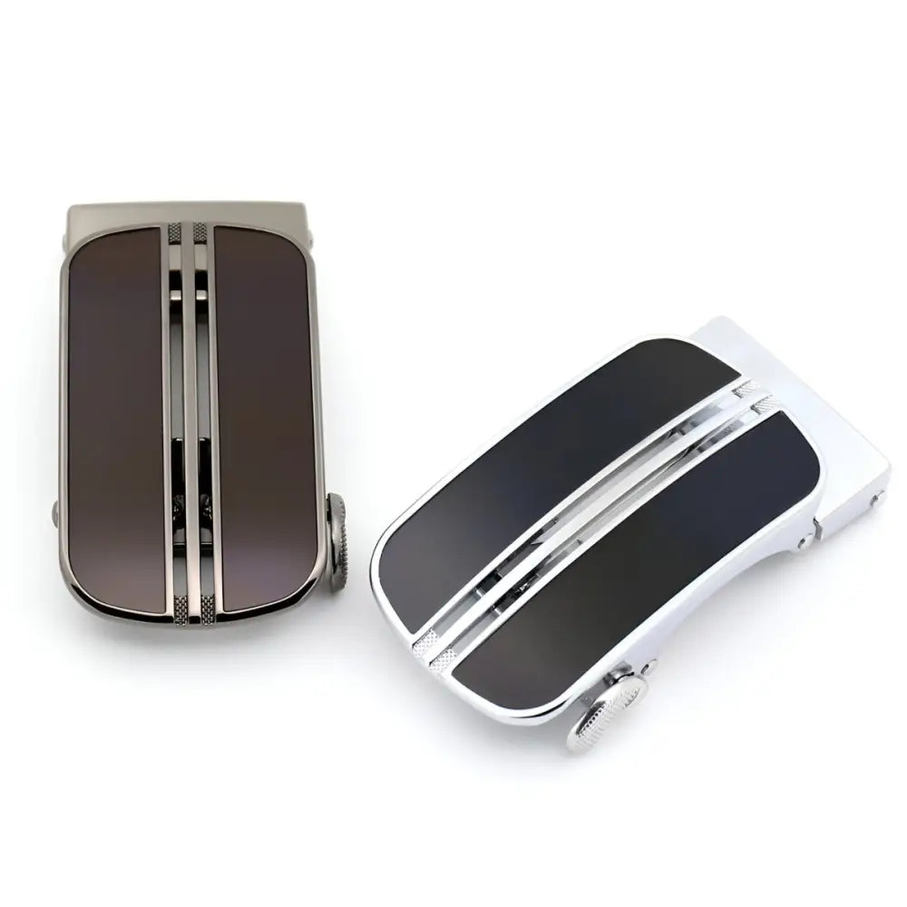 Two metal belt buckles from the Davy Automatic Belt with chrome and black silver buckle