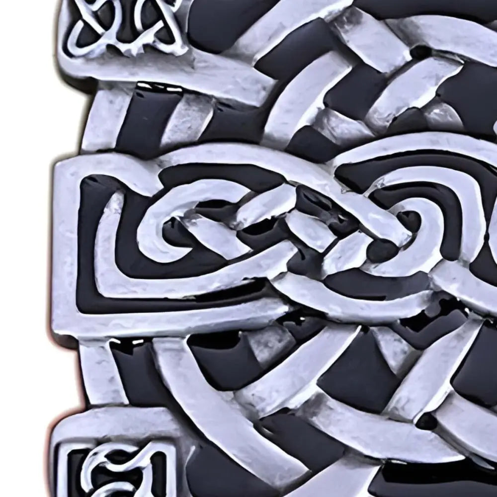 Silver and black Celtic knot brooch with Thuria belt buckle design and intricate knotwork