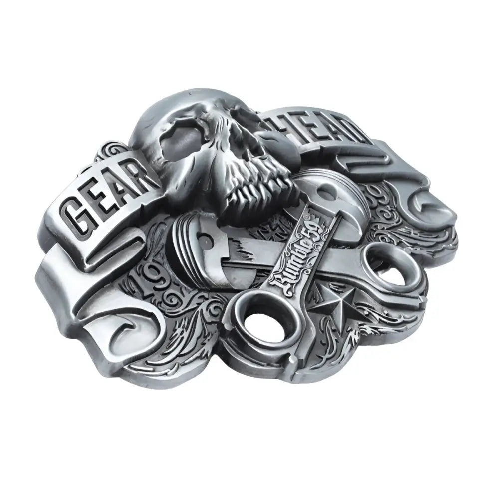 Silver skull and piston gear head belt buckle showcasing a rugged gear head design