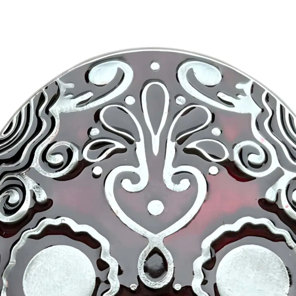 Decorative Mexican skull belt buckle with painted skull fragment and red silver design