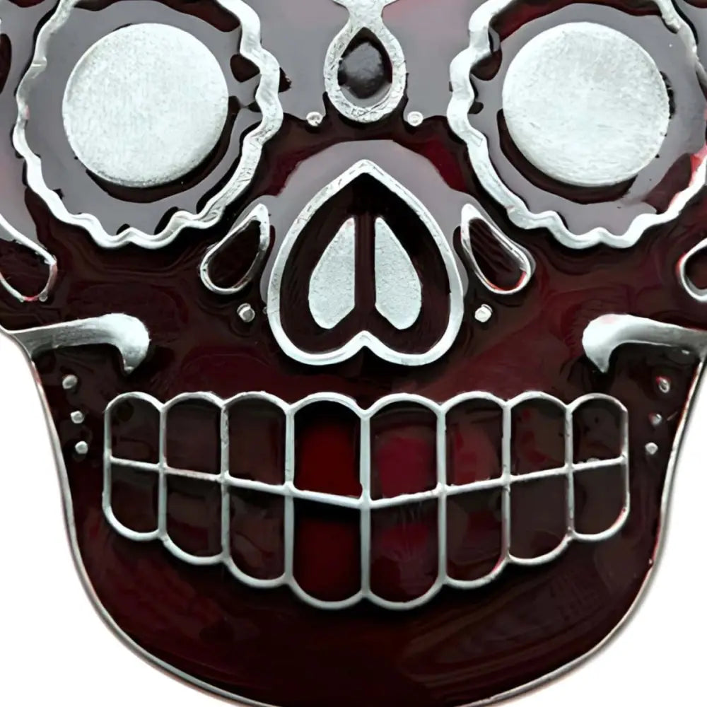 Maroon and silver Mexican skull belt buckle with decorative sugar skull design