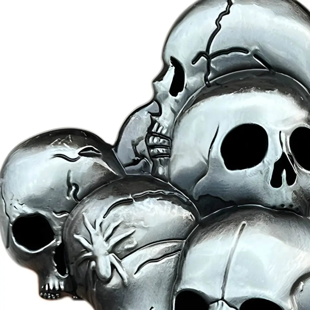 Silver skull belt buckle symbolizing collective strength featuring a pile of silver skulls