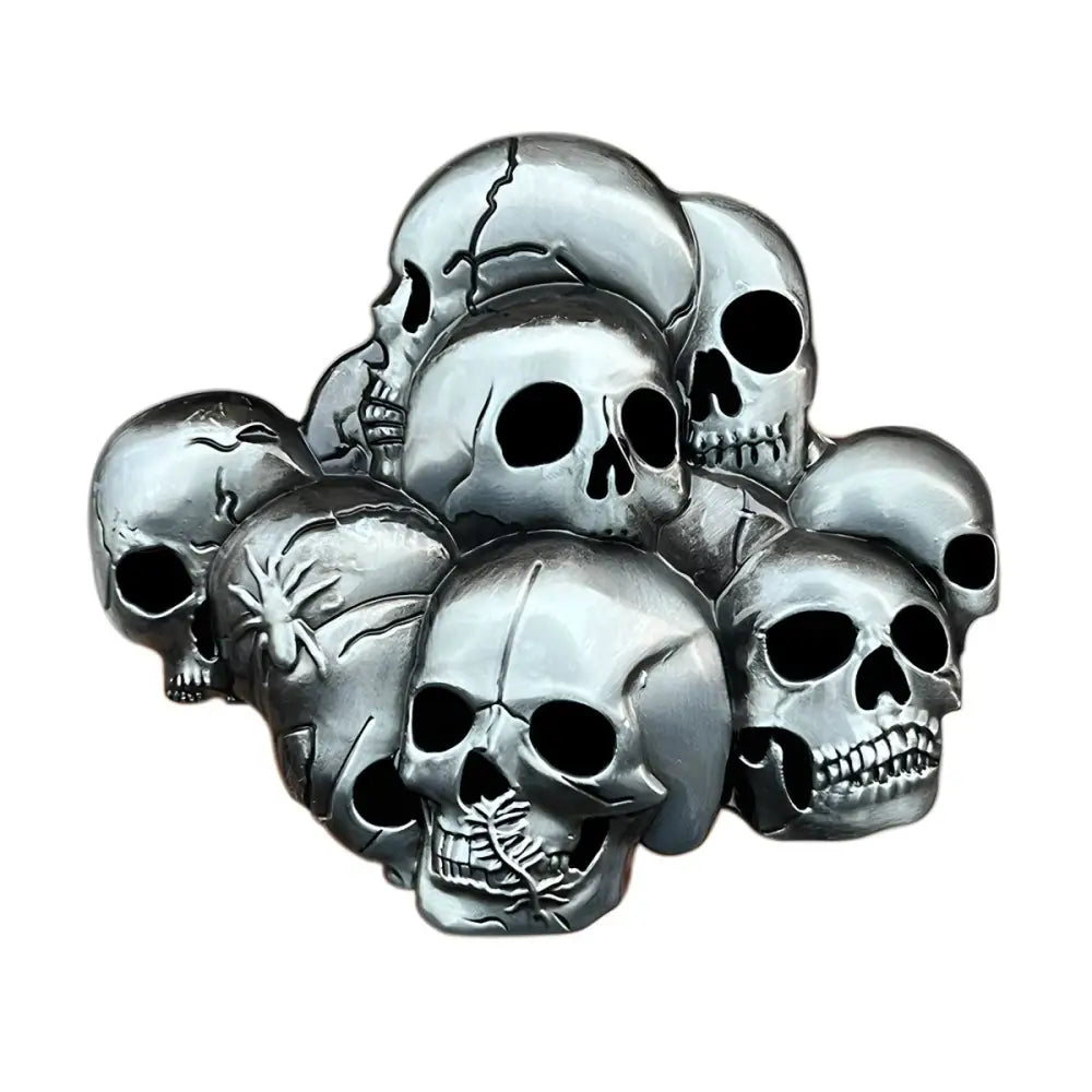 Silver skull belt buckle symbolizing collective strength with a pile of silver-colored skulls