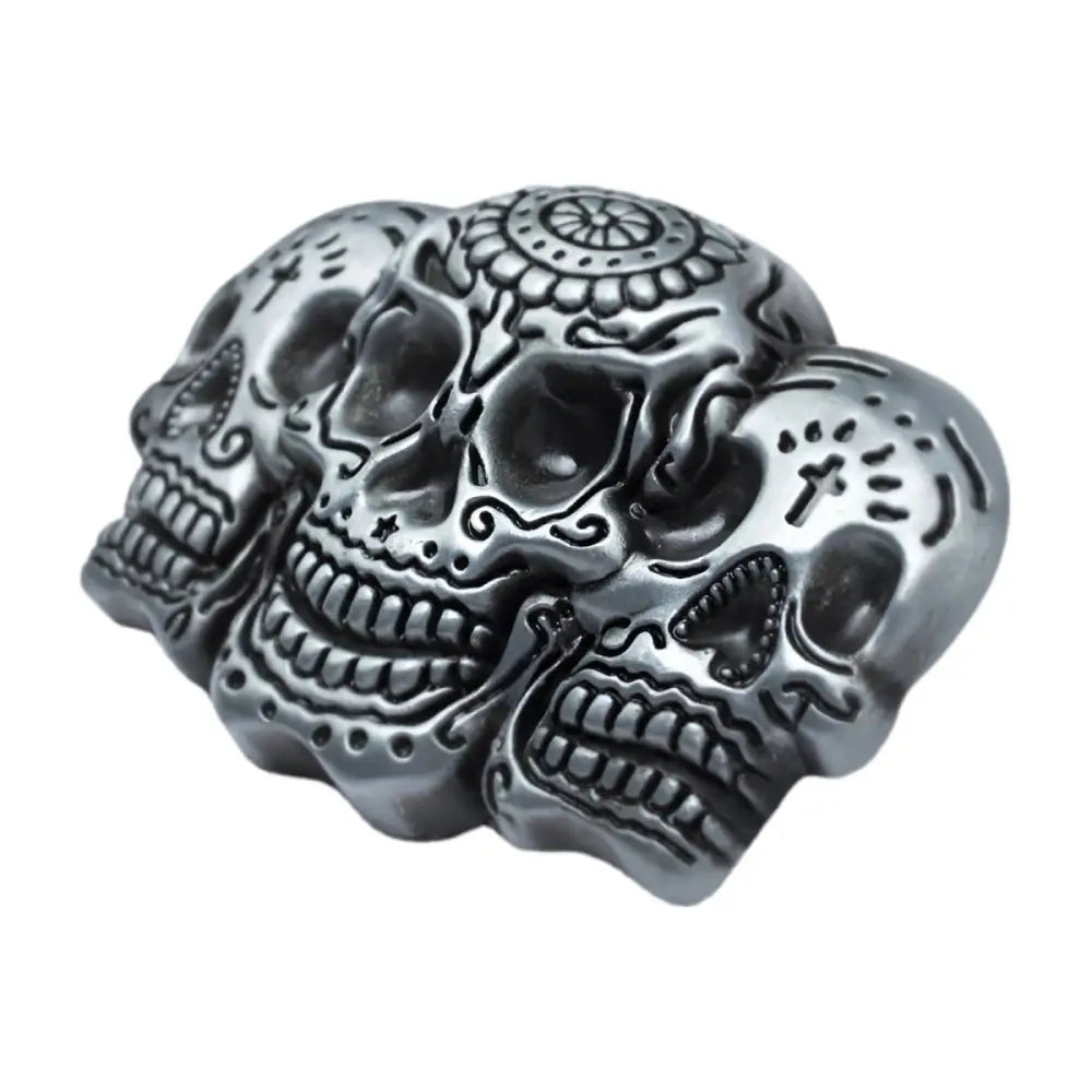 Silver skull belt buckle featuring three decorative metal sugar skulls for unique style