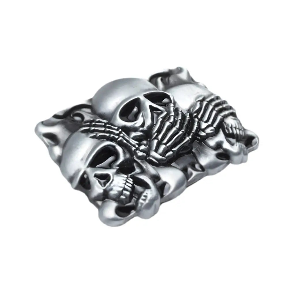 Silver skull belt buckle featuring a triple skull design for bold style fashion accessory