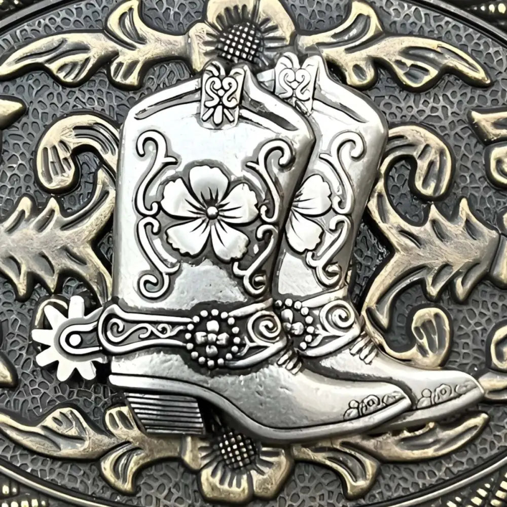 Ornate silver cowboy boot belt buckle with intricate detailing and craftsmanship