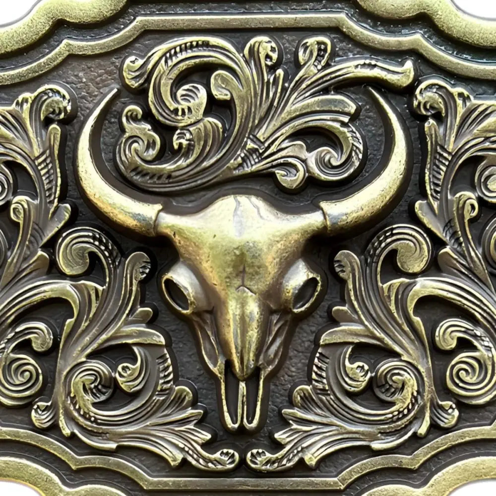 Ornate silver western bull skull belt buckle with floral design highlighting western bull skull detail