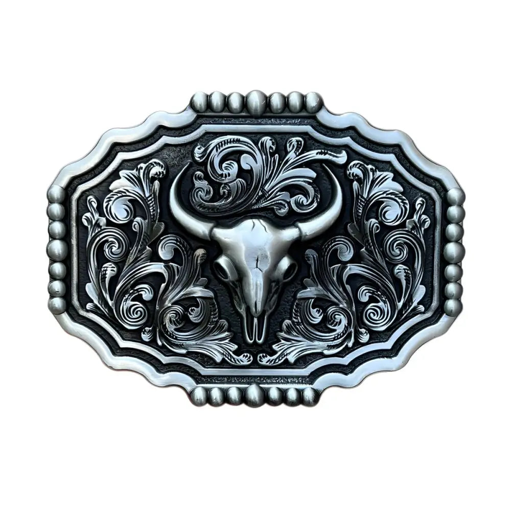 Ornate silver western bull skull belt buckle with floral design and detailed bull skull artwork