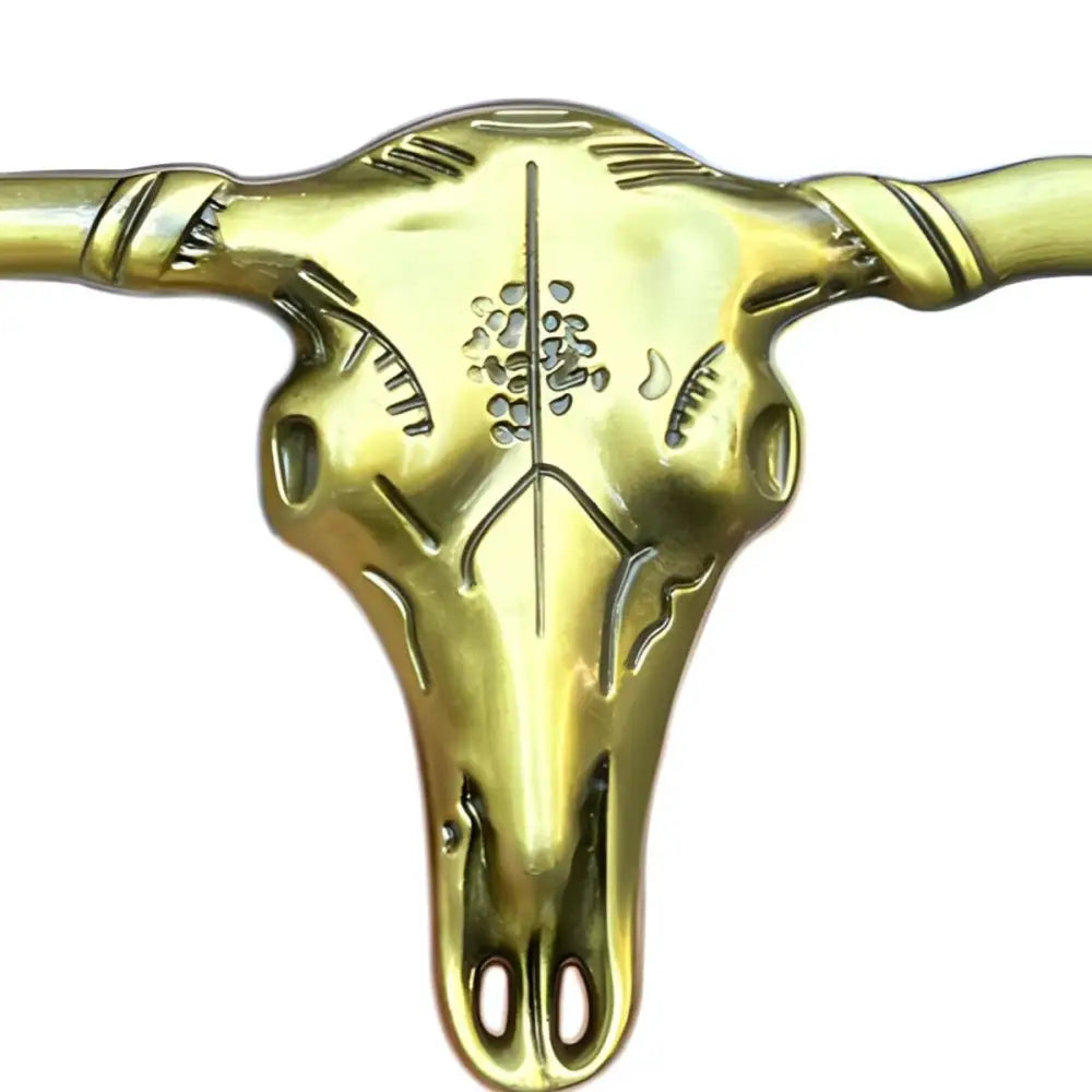 Golden and silver steer skull belt buckle with etched designs, Stanley Model craftsmanship