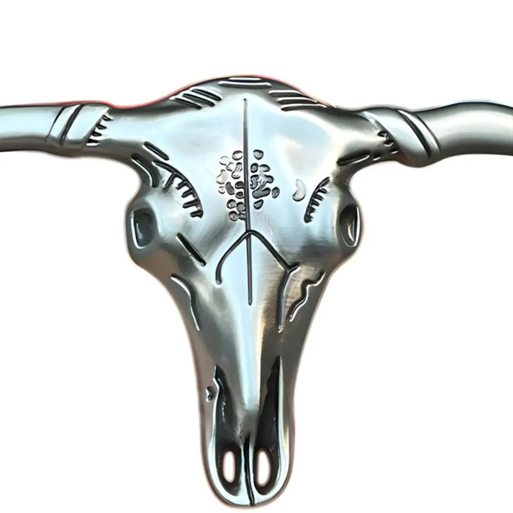 Silver-colored steer skull belt buckle with etched designs, Stanley Model craftsmanship