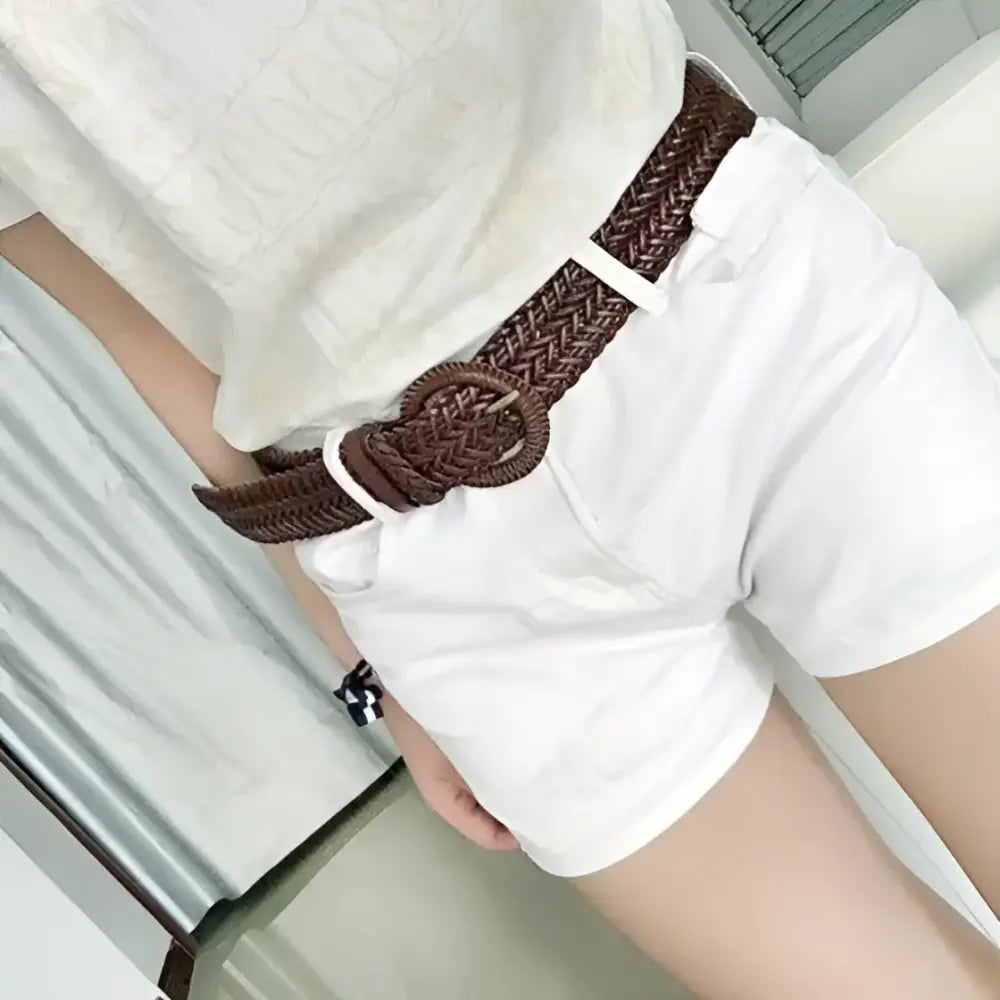 Braided brown leather belt with circular buckle displayed for the product Braided Brown Leather Belt with Circular Buckle