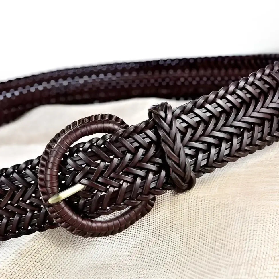 Braided brown leather belt with circular buckle displayed in product image