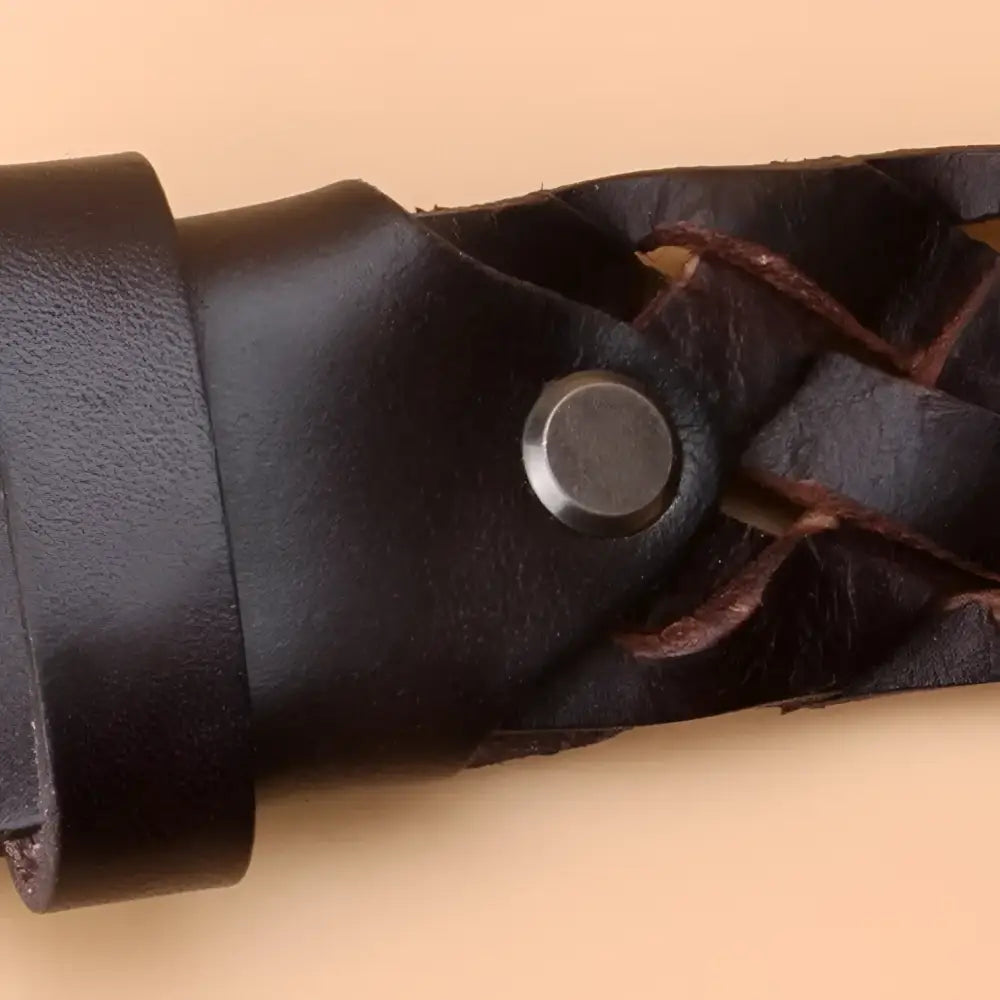 Dark braided leather belt with metal button and silver buckle for stylish accesso