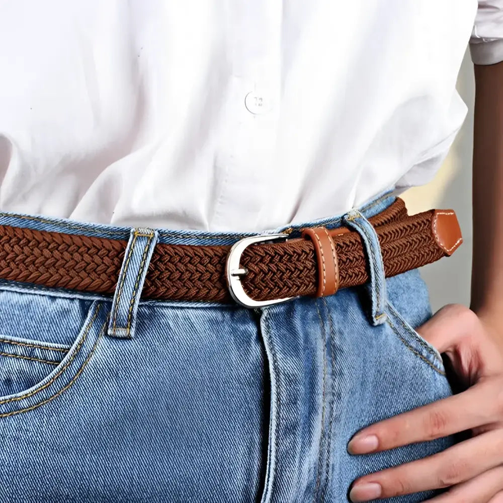 Braided brown elastic belt with leather accents and silver buckle for stylish wear