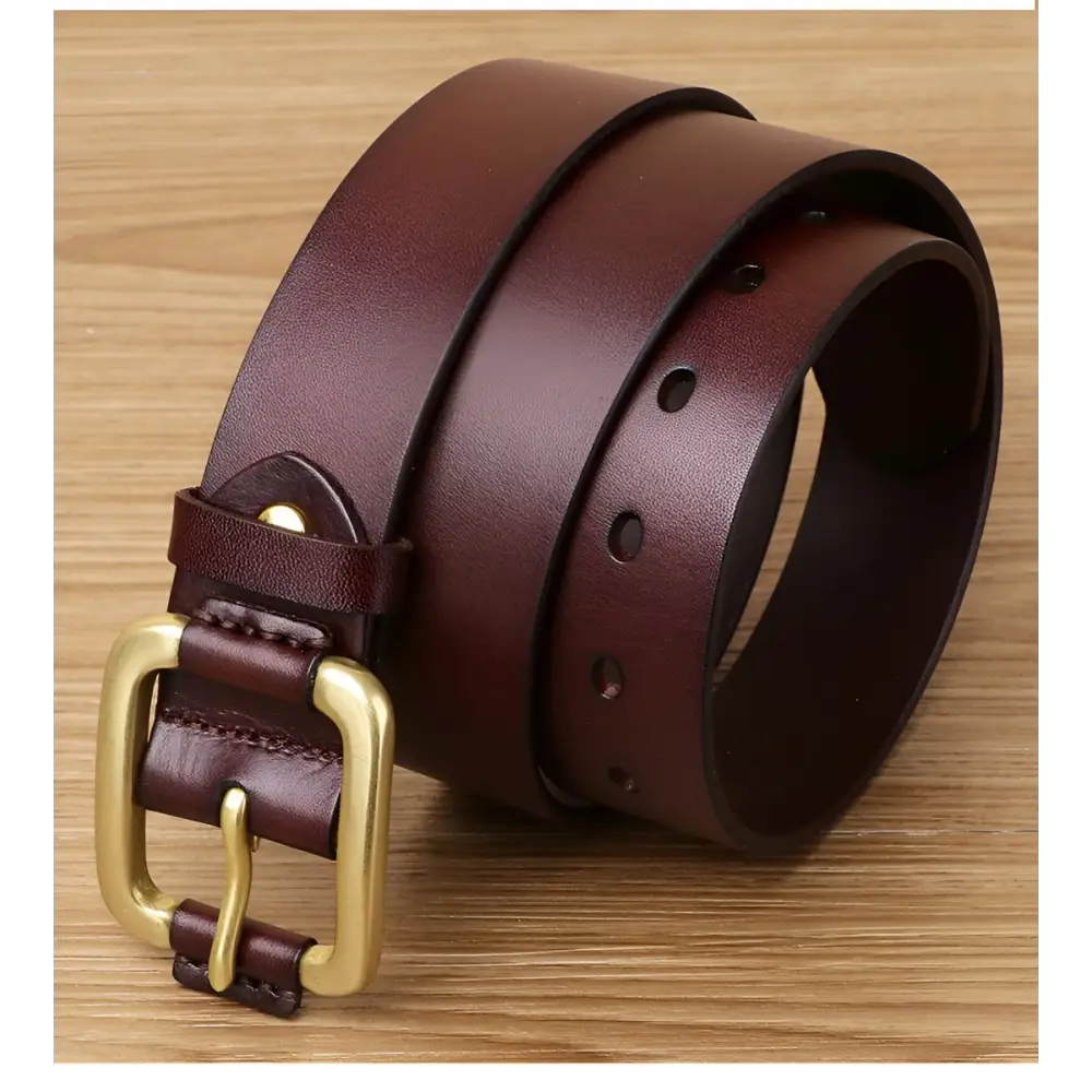 Burgundy leather belt with brass buckle displayed on Brown Leather Belt with Brass and Gold Buckle product