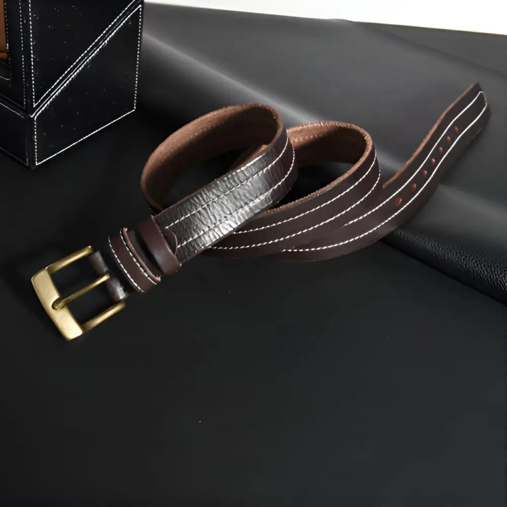 Brown leather belt with white stitching and brass buckle for stylish men’s accessories