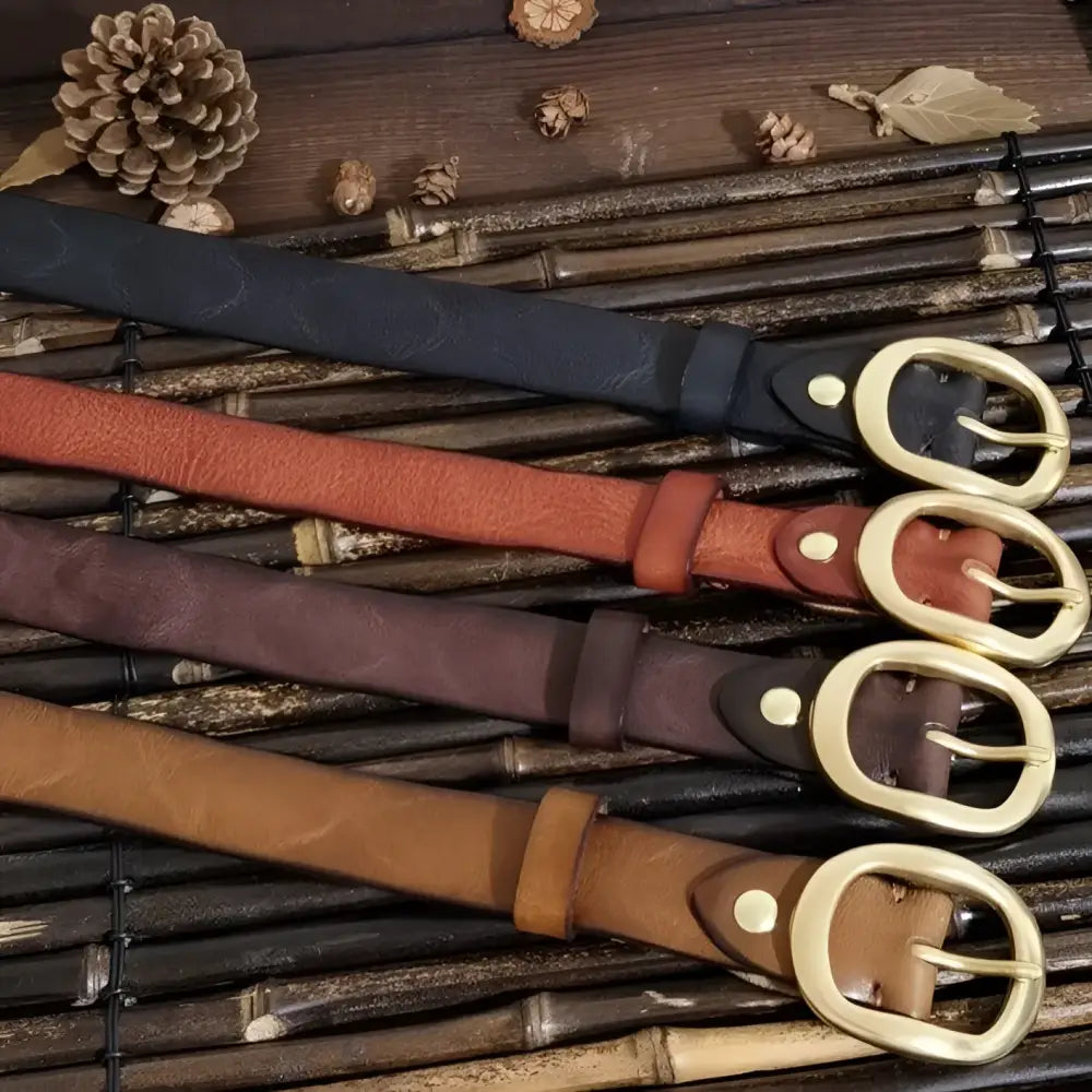 Four leather belts with brass buckles displayed on Brown Leather Belt with Brass Buckle product