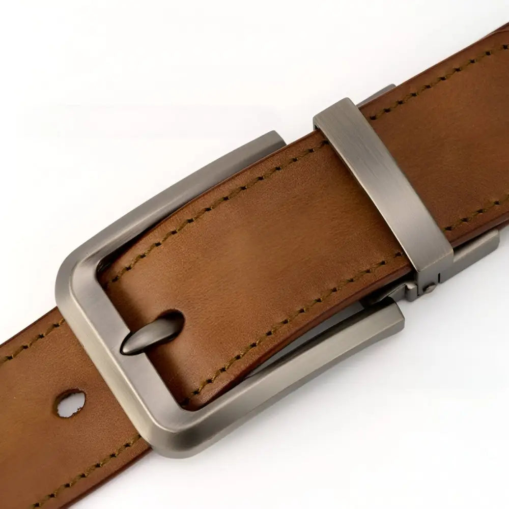 Brown leather belt with a silver metal buckle displayed in the product Brown Leather Belt with Silver Buckle