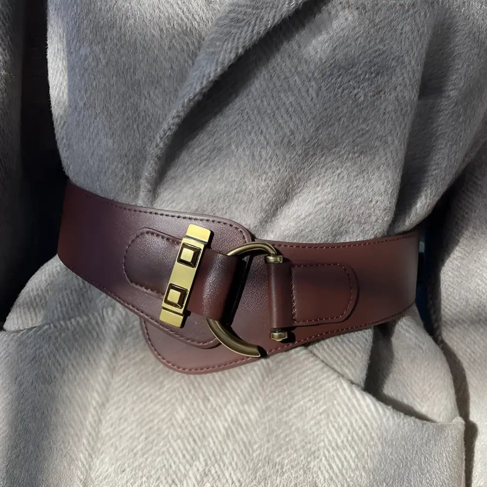 Brown leather belt with a gold buckle from the Brown Leather Belts and Teddy Bear Coat collection