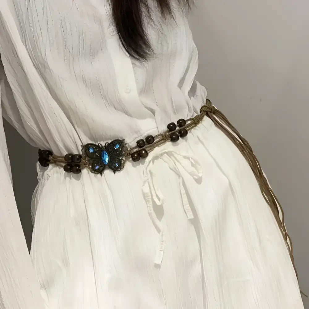 White dress with Ara belt featuring beaded butterfly design and waxed cotton accents