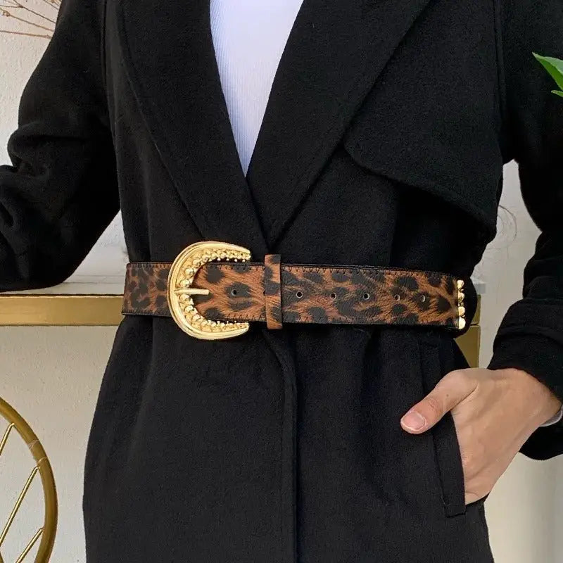 Leopard print belt with gold buckle, stylish accessory for fashion ensembles