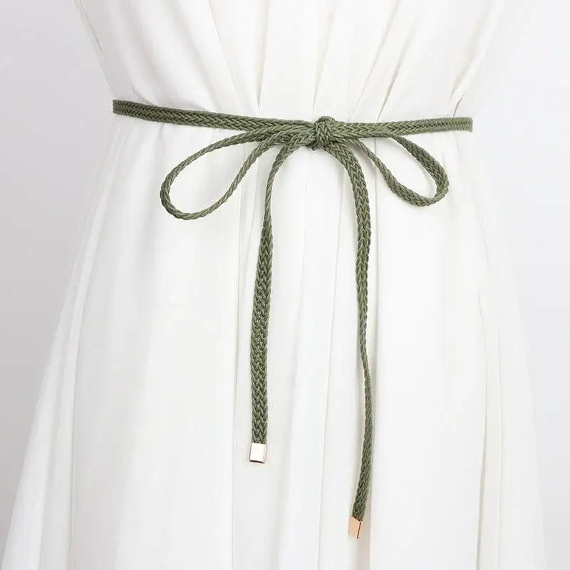 Braided green belt tied in a bow for a classic look alongside the Braided Brown Belt with Tie Bow