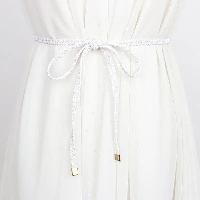 White braided belt tied in a bow, perfect for a classic and stylish look