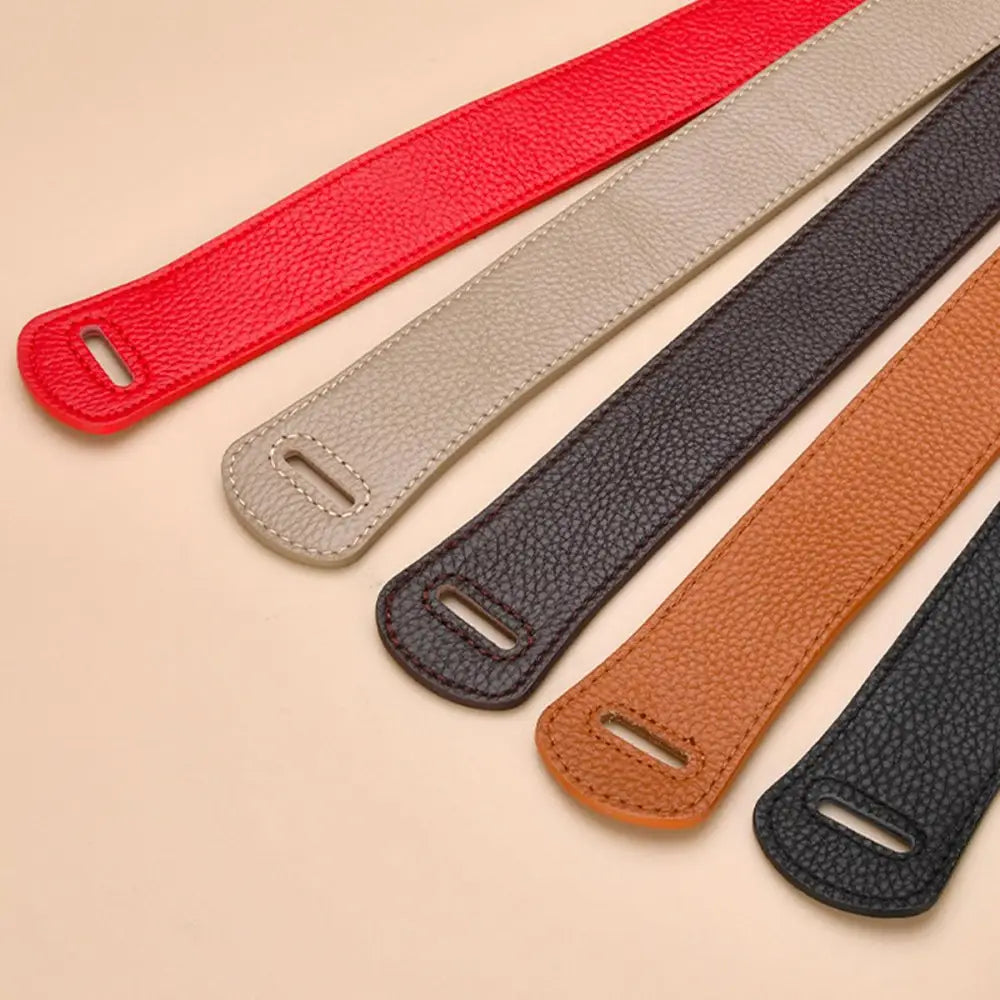 Colorful leather bag handles complementing the Thiphilia Tie Belt in the Houndstooth Blazer